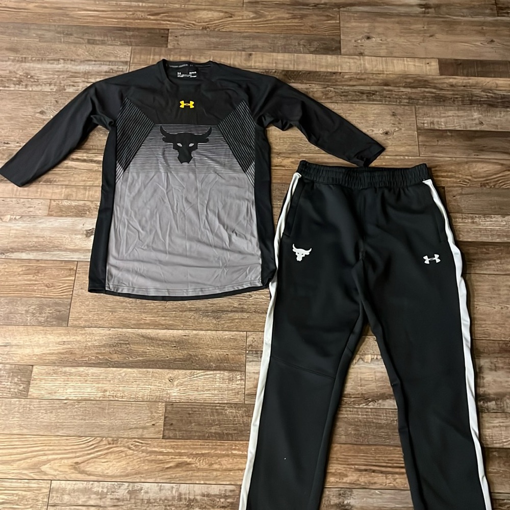 Men’s Under Armour Chris Rock Project Rock Edition. Never worn. Zippered ankle.